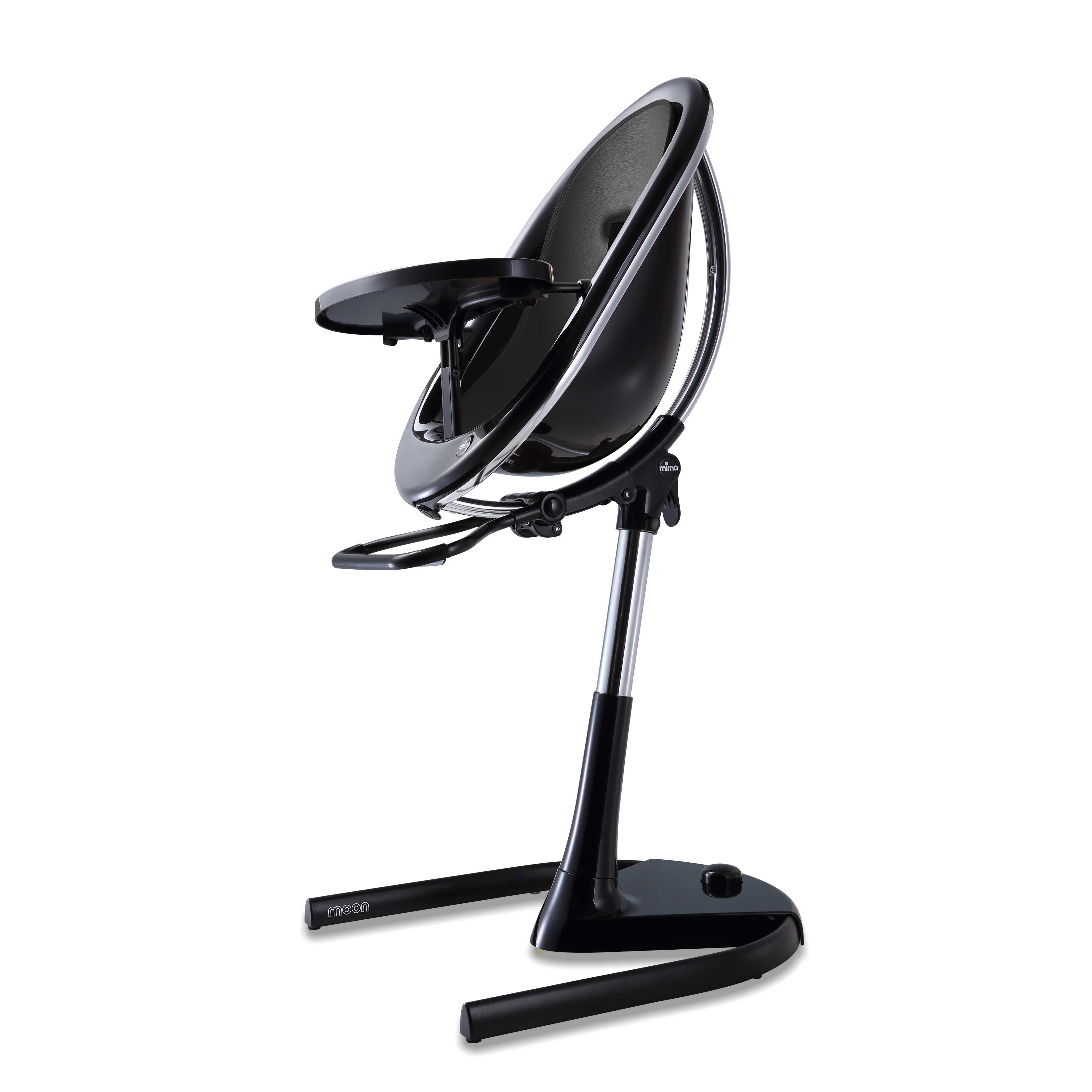 Black Mima Moon 2G high chair with black seat pad, side view, modern with transparent back