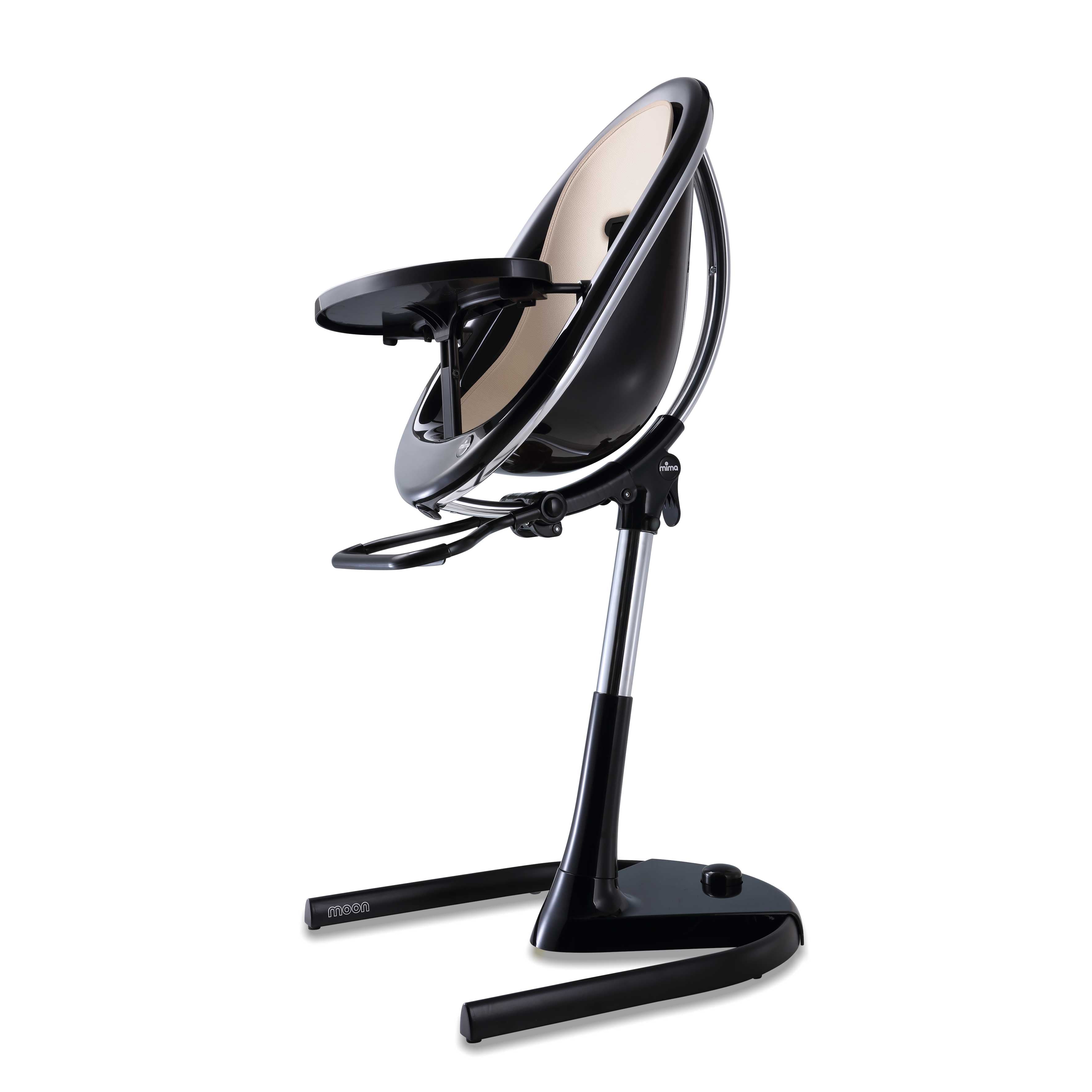 Black Mima Moon 2G high chair with champagne seat pad, side view, modern with transparent back