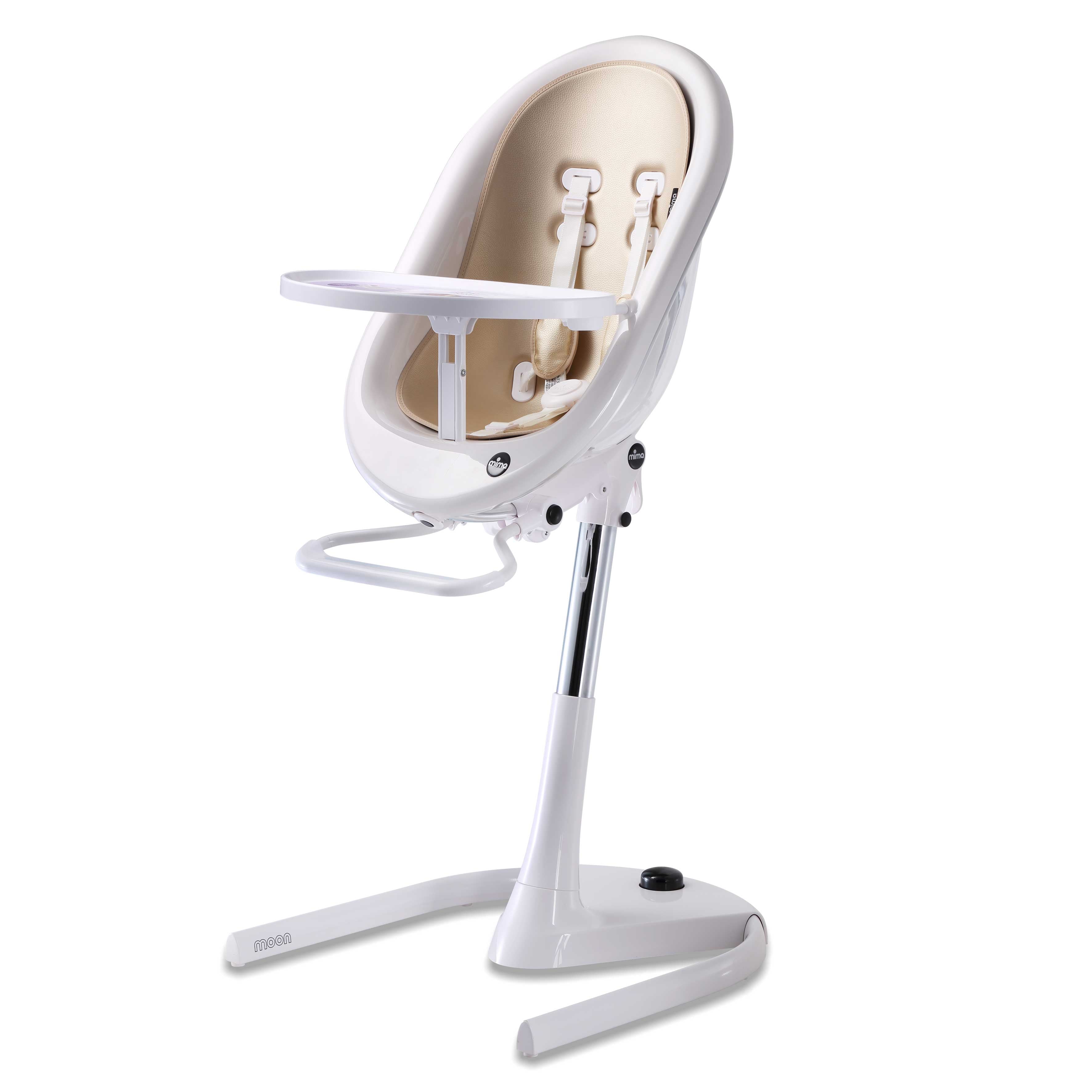 White Mima Moon 2G high chair at max height, with champagne seat pad, tray, harness and adjustable footrest, right-front view