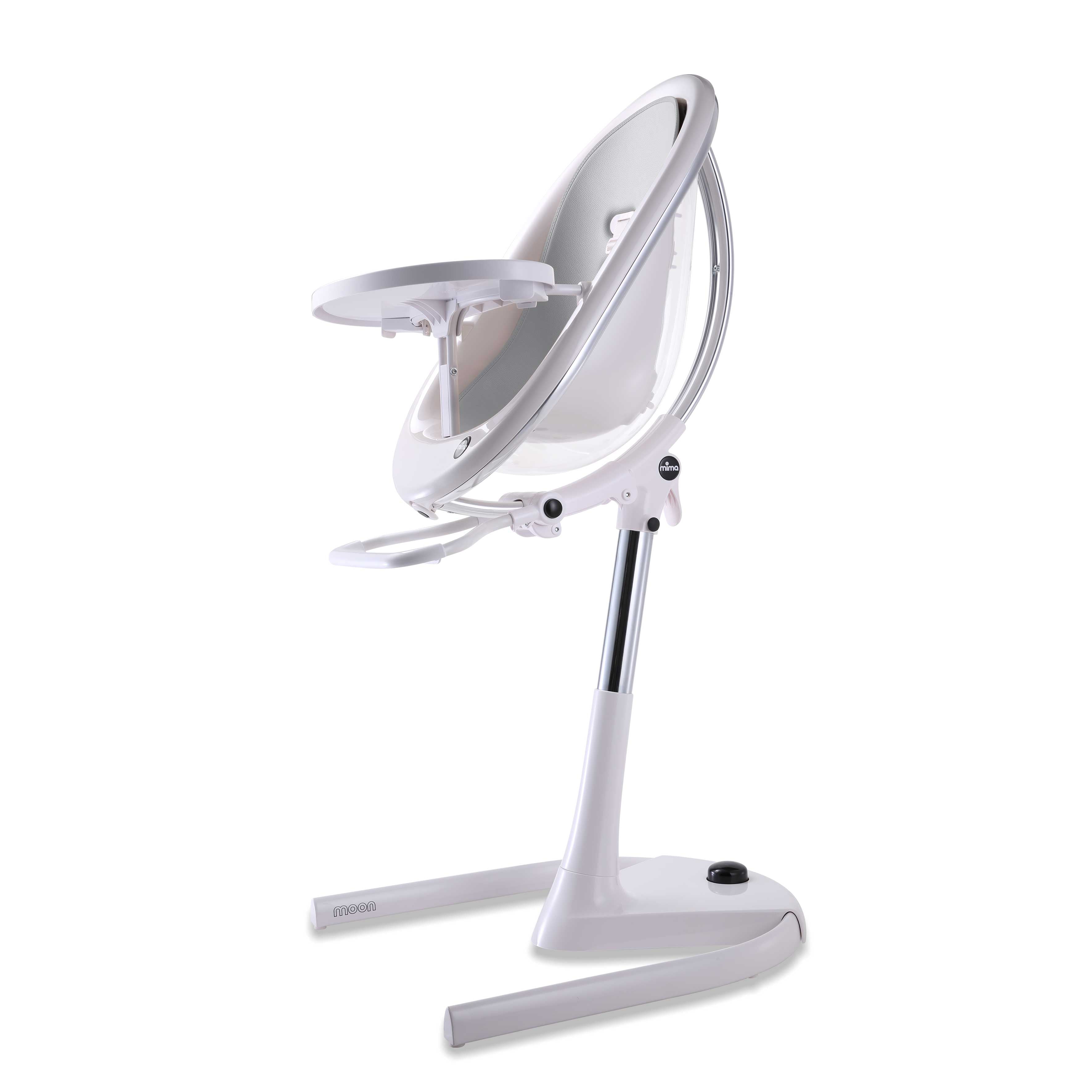 White Mima Moon 2G high chair with silver seat pad, side view, modern with transparent back