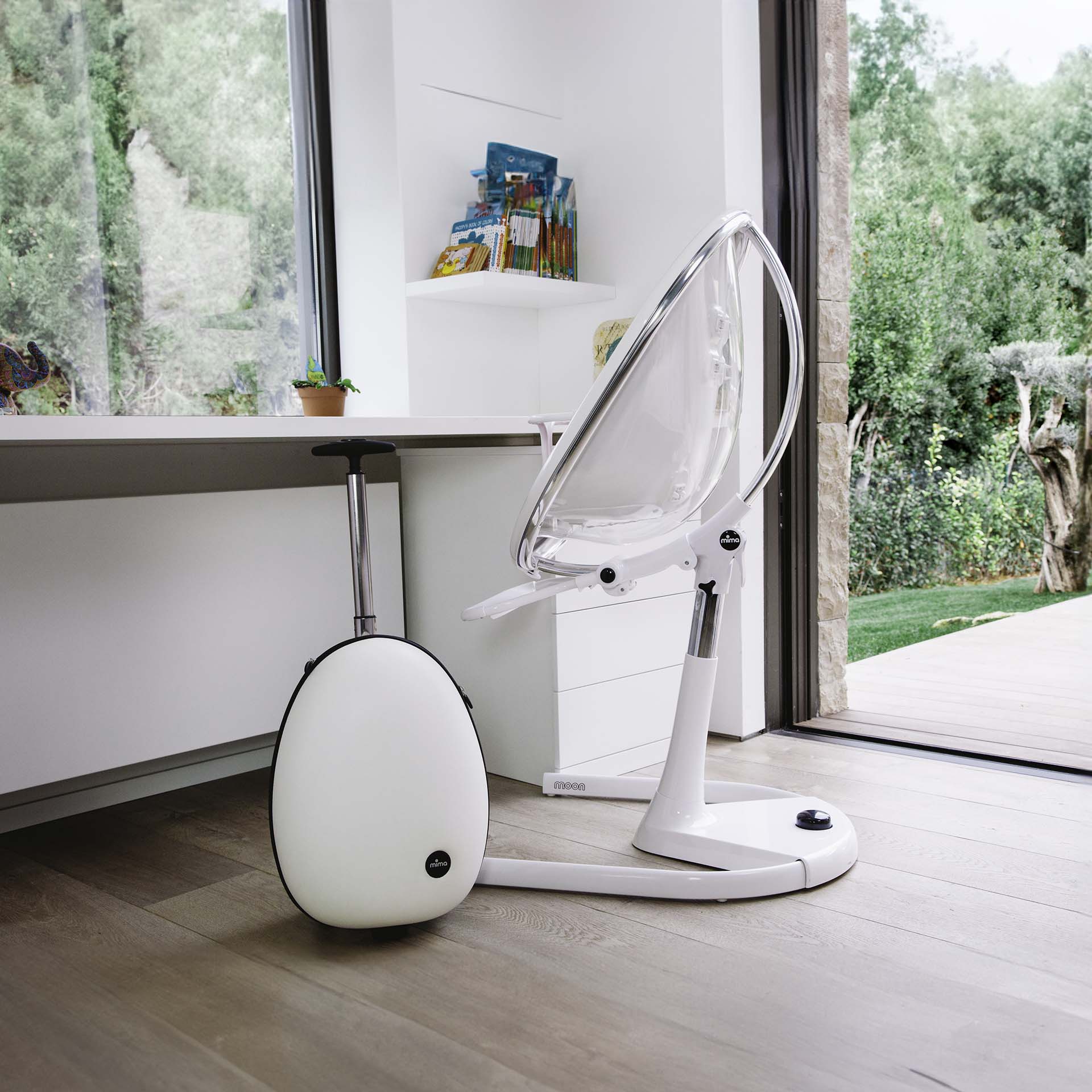 white Mima Moon 2G high chair and white ovi, indoor near window