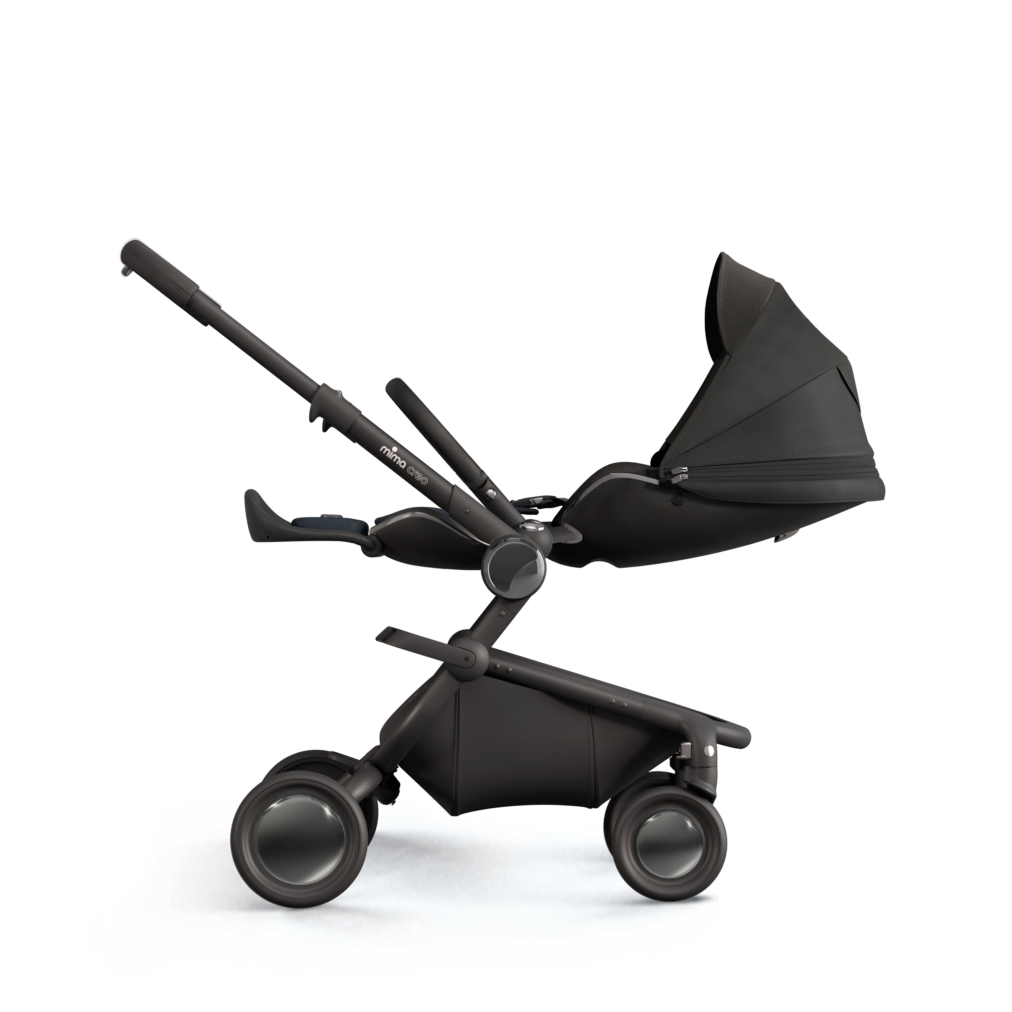 mima creo stroller in black with seat fully reclined into a flat position, side view, facing parents