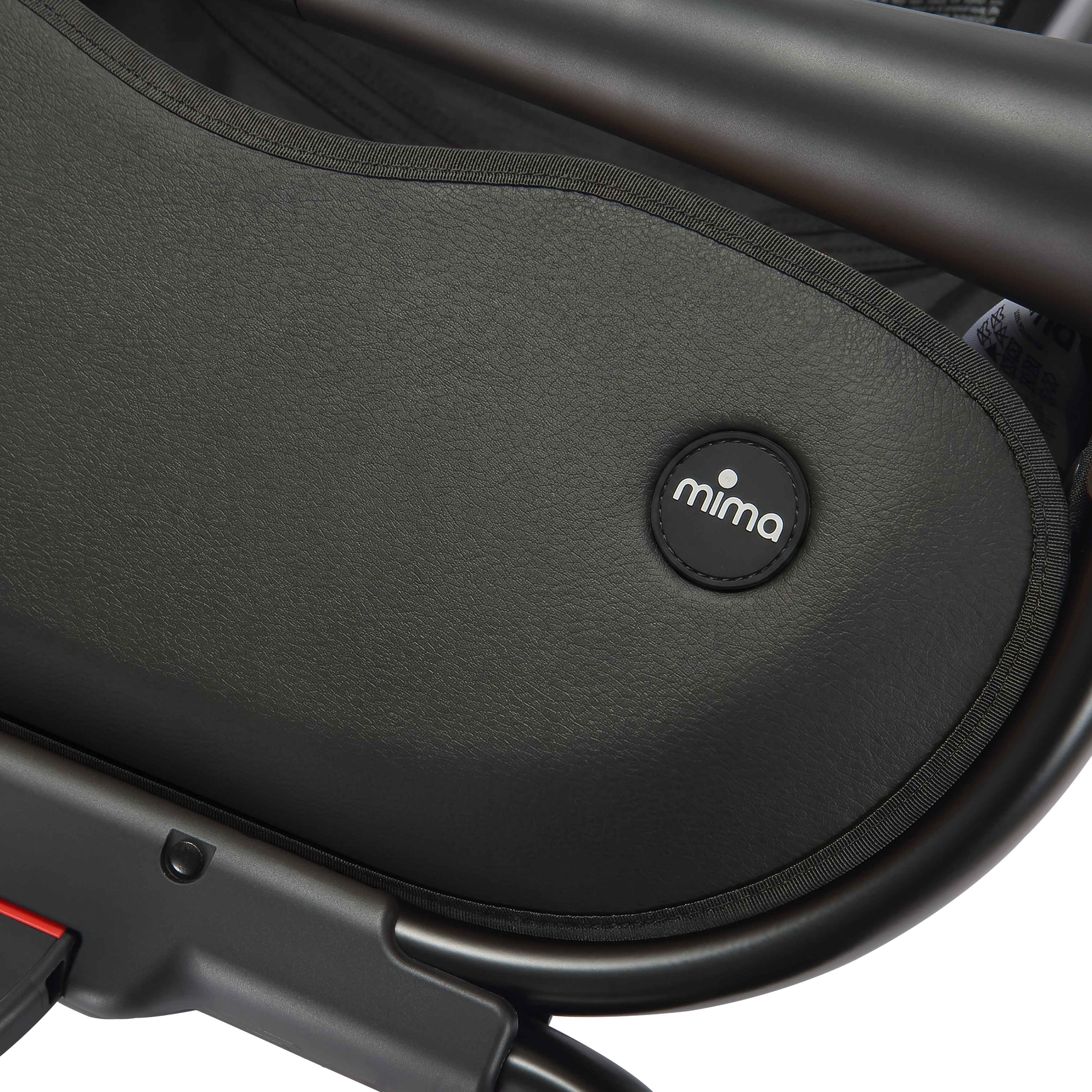 close up of the mima creo stroller basket and logo in black