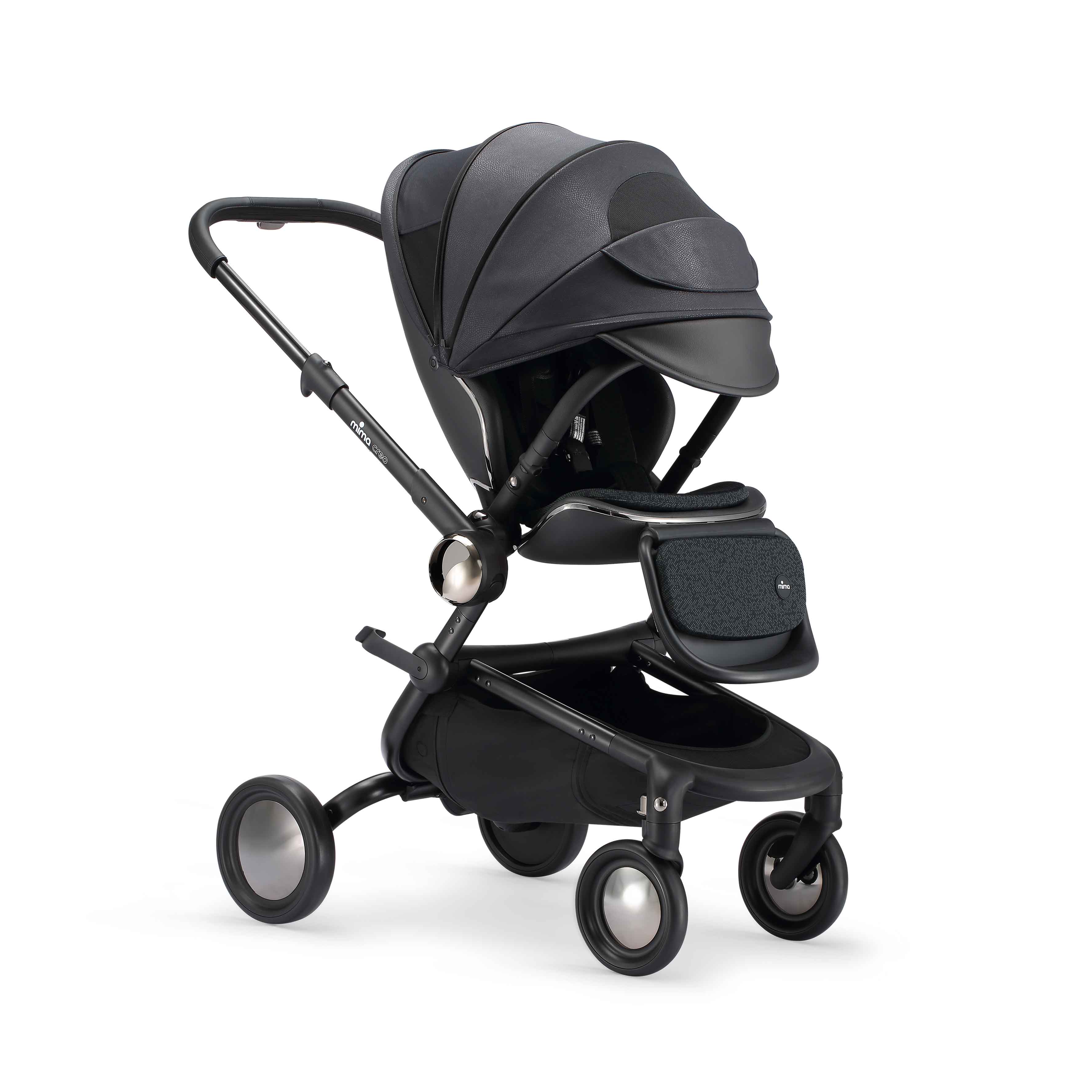 mima creo stroller in black with fully extended canopy and open window, angled view
