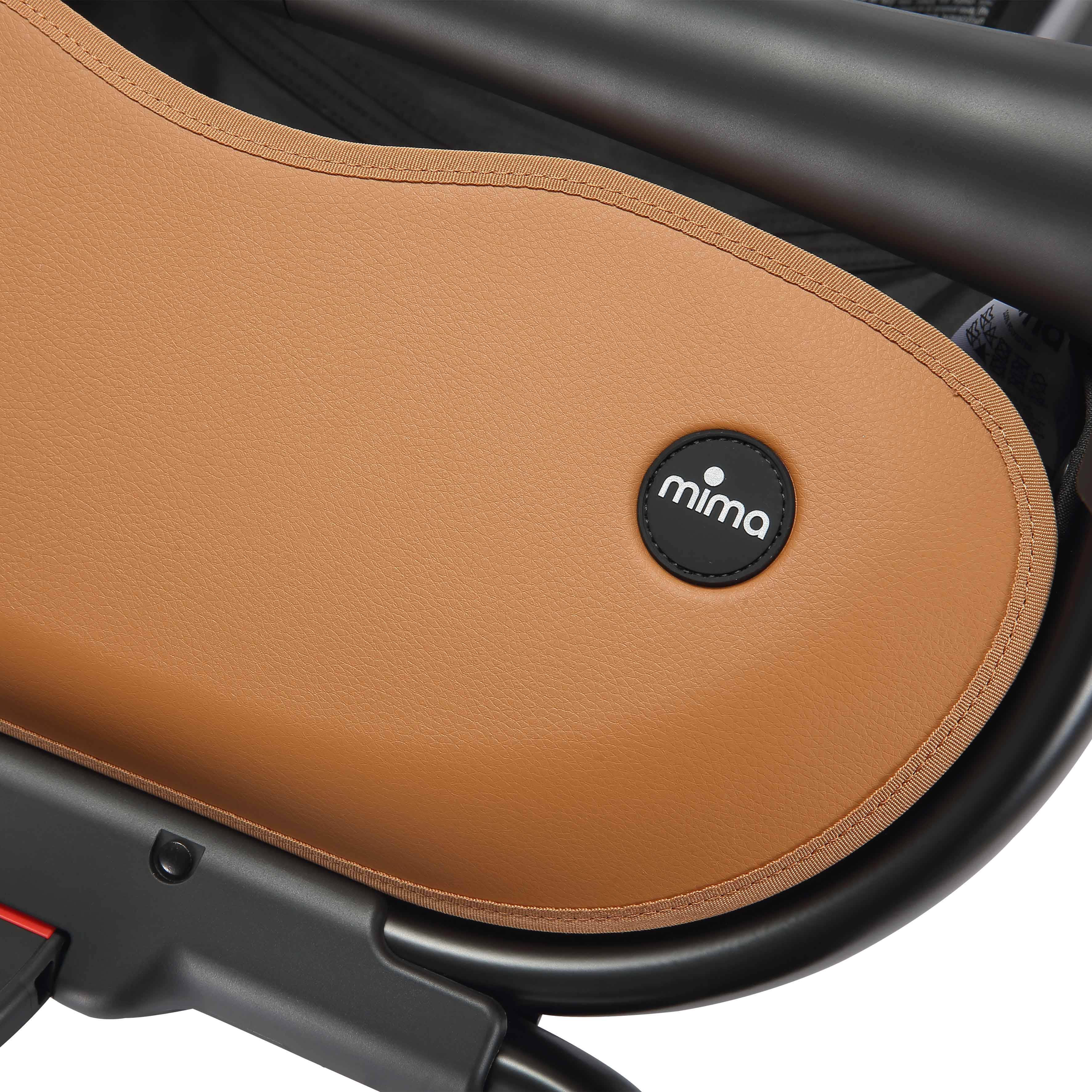 close up of the mima creo stroller basket and logo in mocha cream