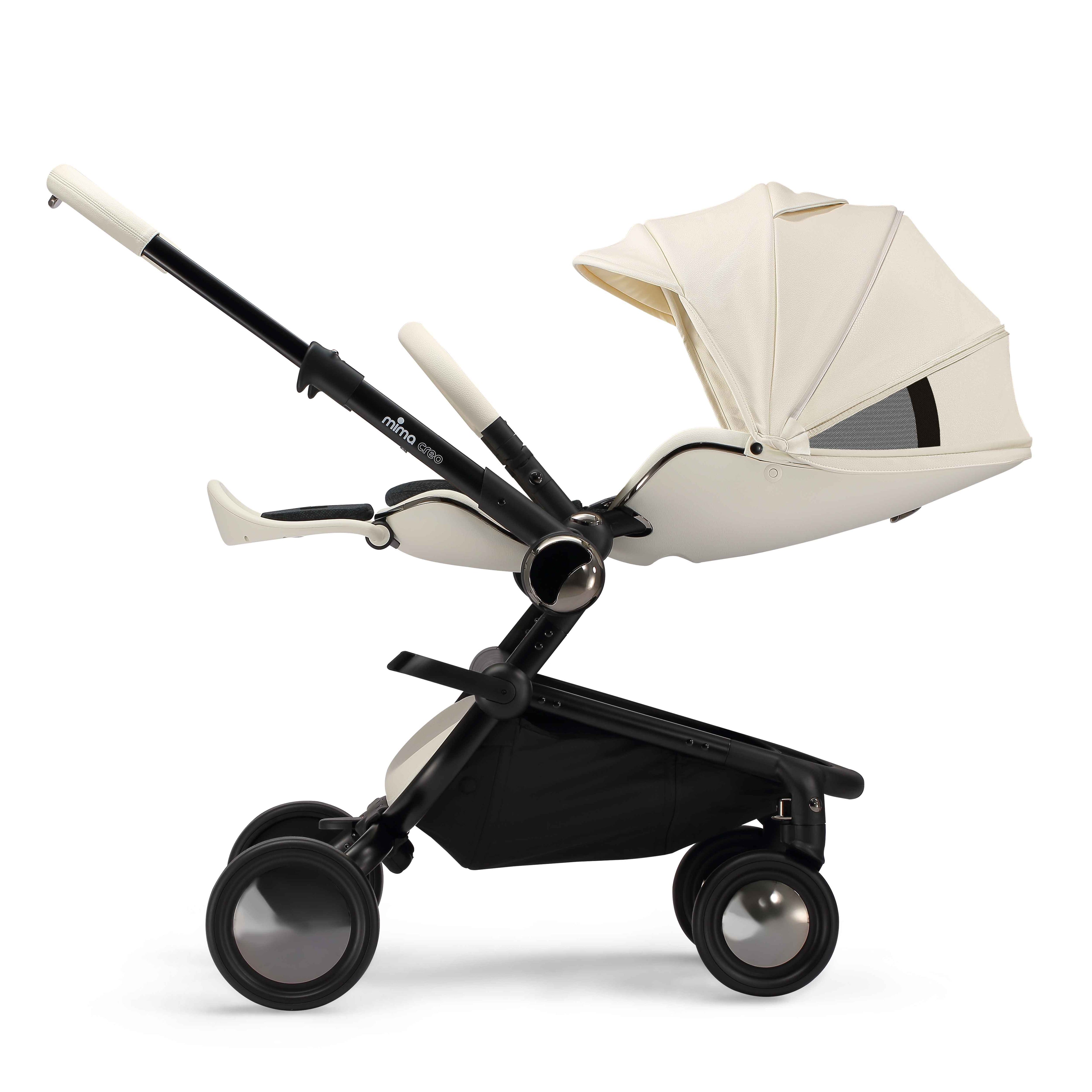 side view of parent facing fully reclined mima creo compact stroller in white