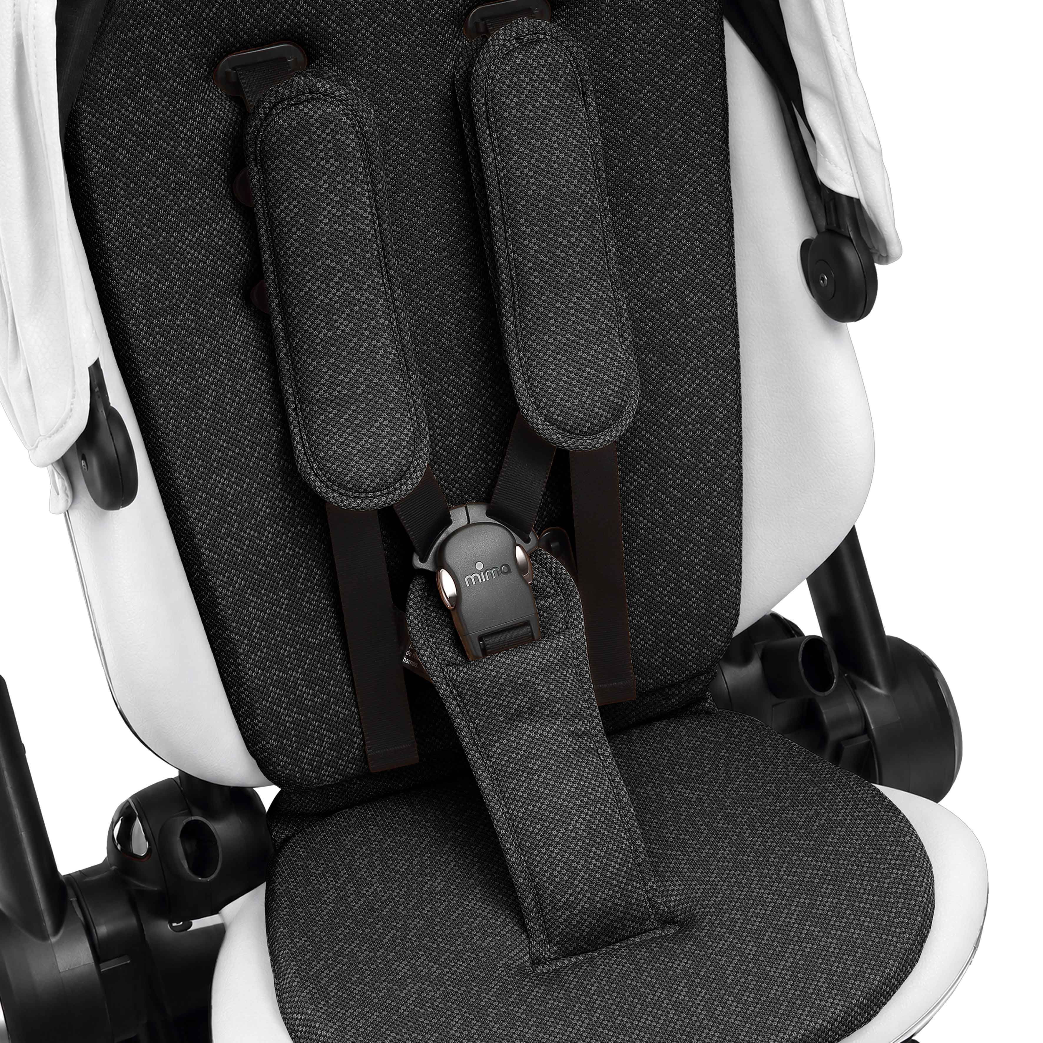 interior view of the seat pad and safety harness on mima creo in white