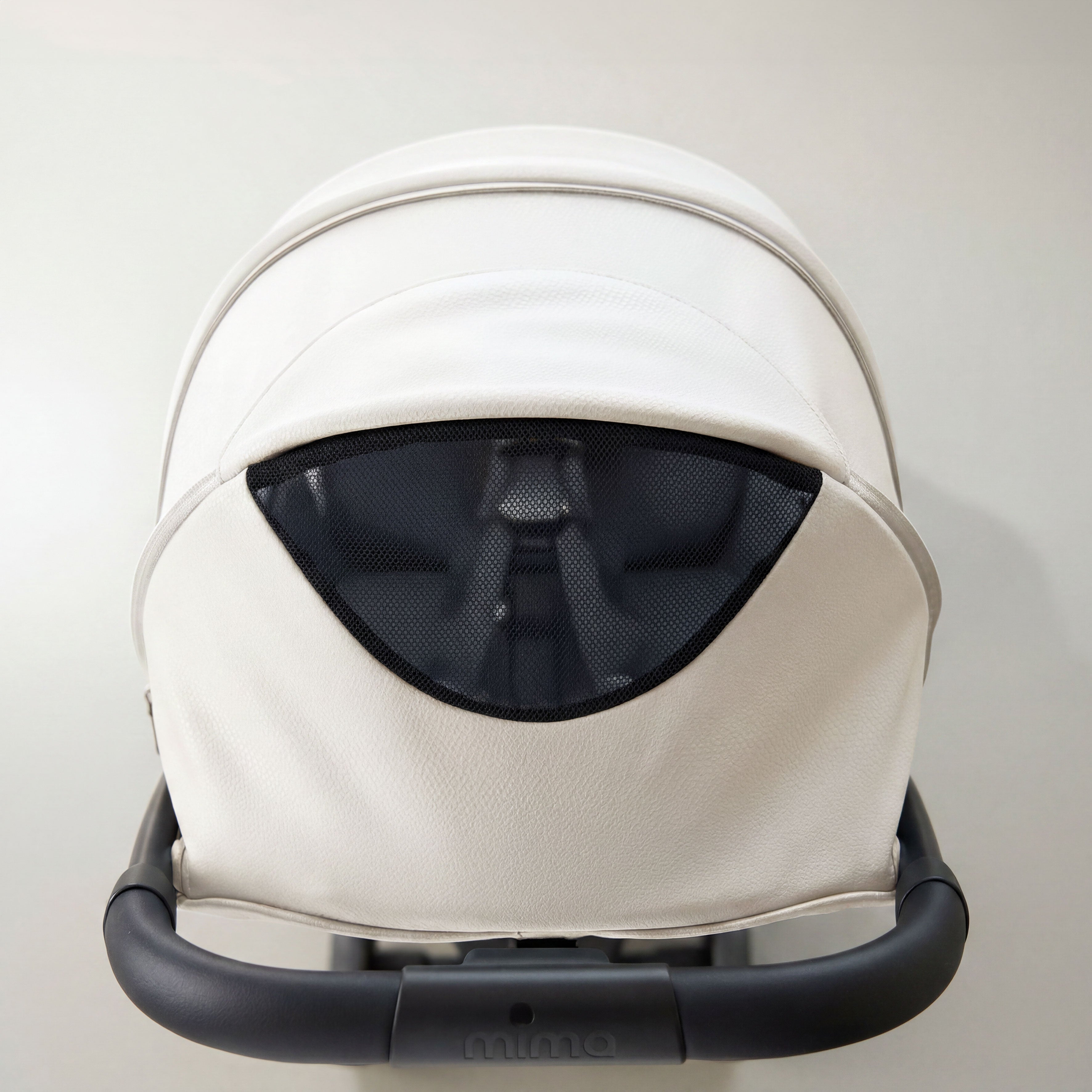 top view of open canopy ventilation window on mima miro stroller in white