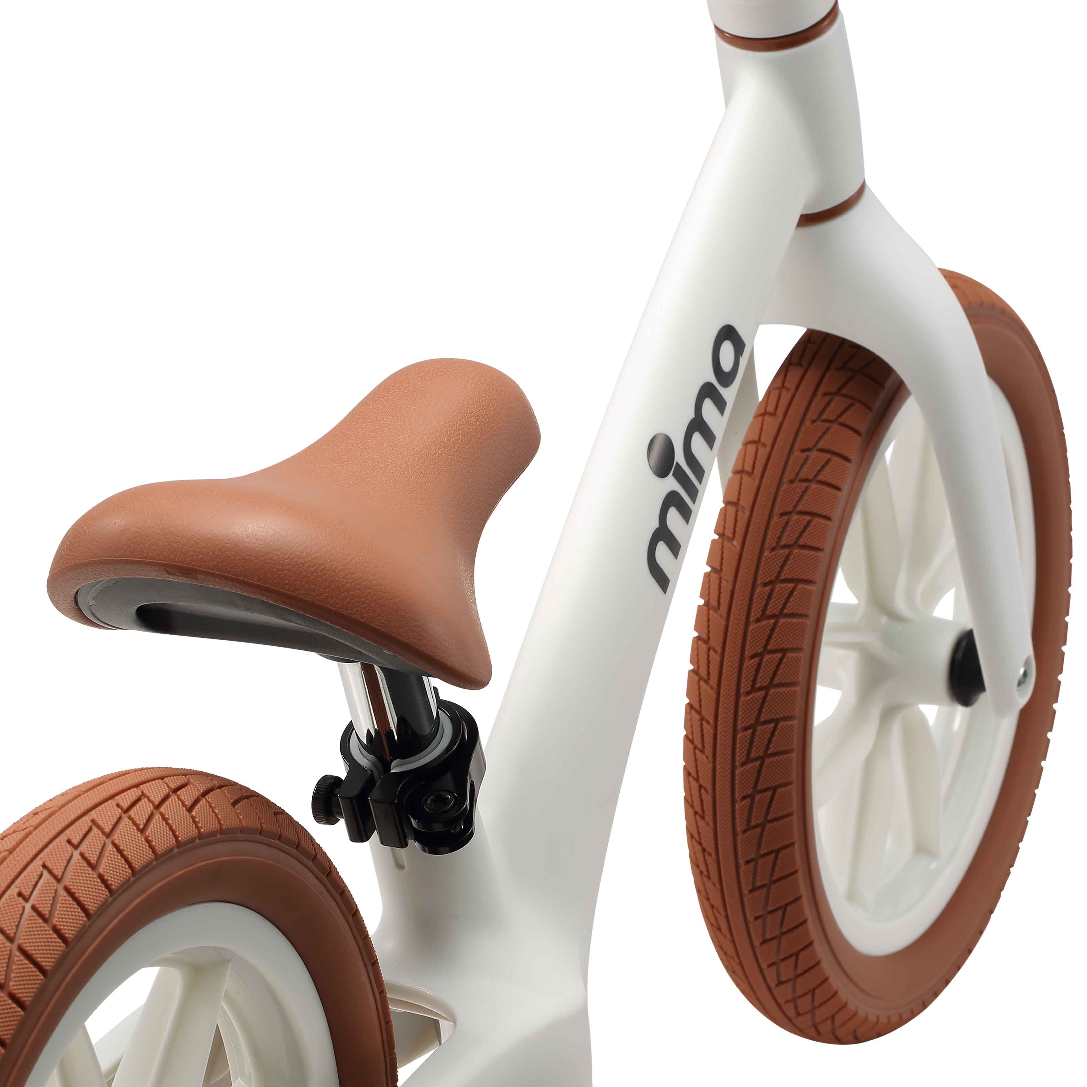 close up of the seat saddle on mima zoom lite balance bike in white