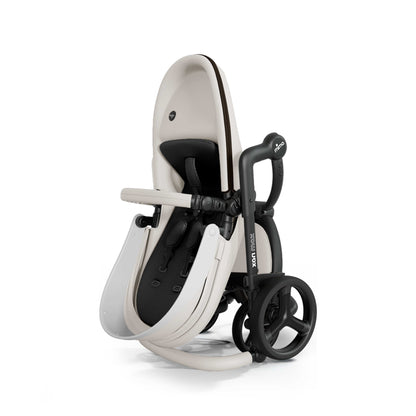 mima® xari max stroller, in black chassis, snow white seat and black seat pad, shown fully folded in a compact, upright position