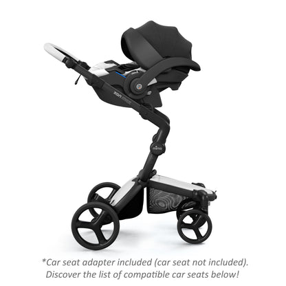 mima® xari max stroller with an attached BeSafe snow white infant car seat, facing parents, side view