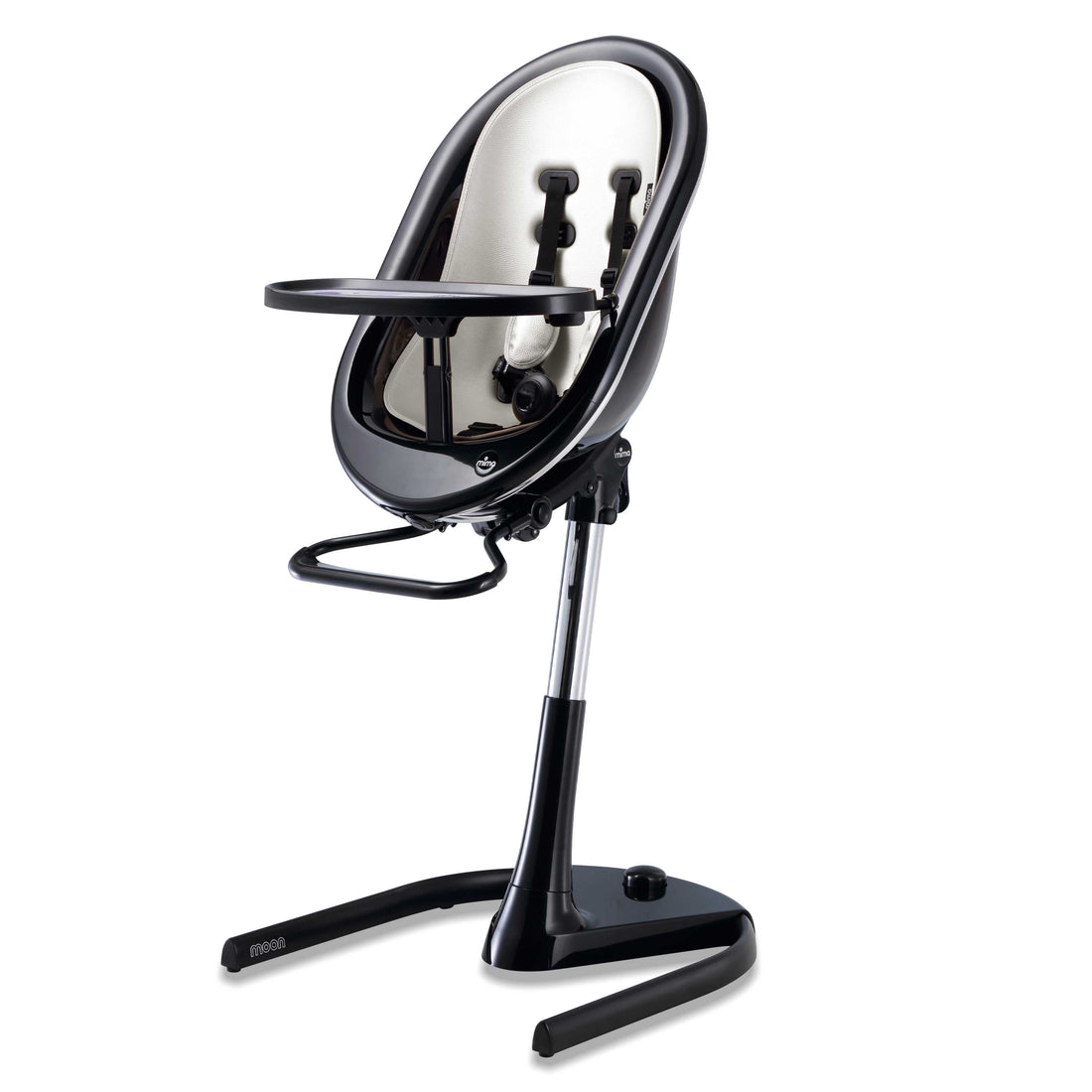 Black Mima Moon 2G high chair at max height, with snow white seat pad, tray, harness and adjustable footrest, right-front view 