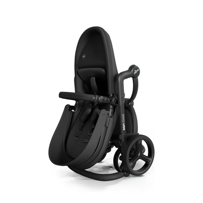 mima® xari max stroller, in black chassis, black seat and black seat pad, shown fully folded in a compact, upright position