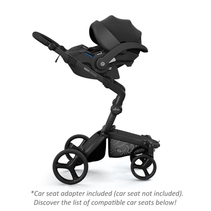 mima® xari max stroller with an attached BeSafe black infant car seat, facing parents, side view