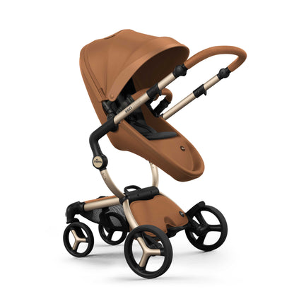 mima® xari max stroller, in champagne chassis, camel seat and black seat pad, with canopy and safety bar, facing parents, left front-angle view, Mom&