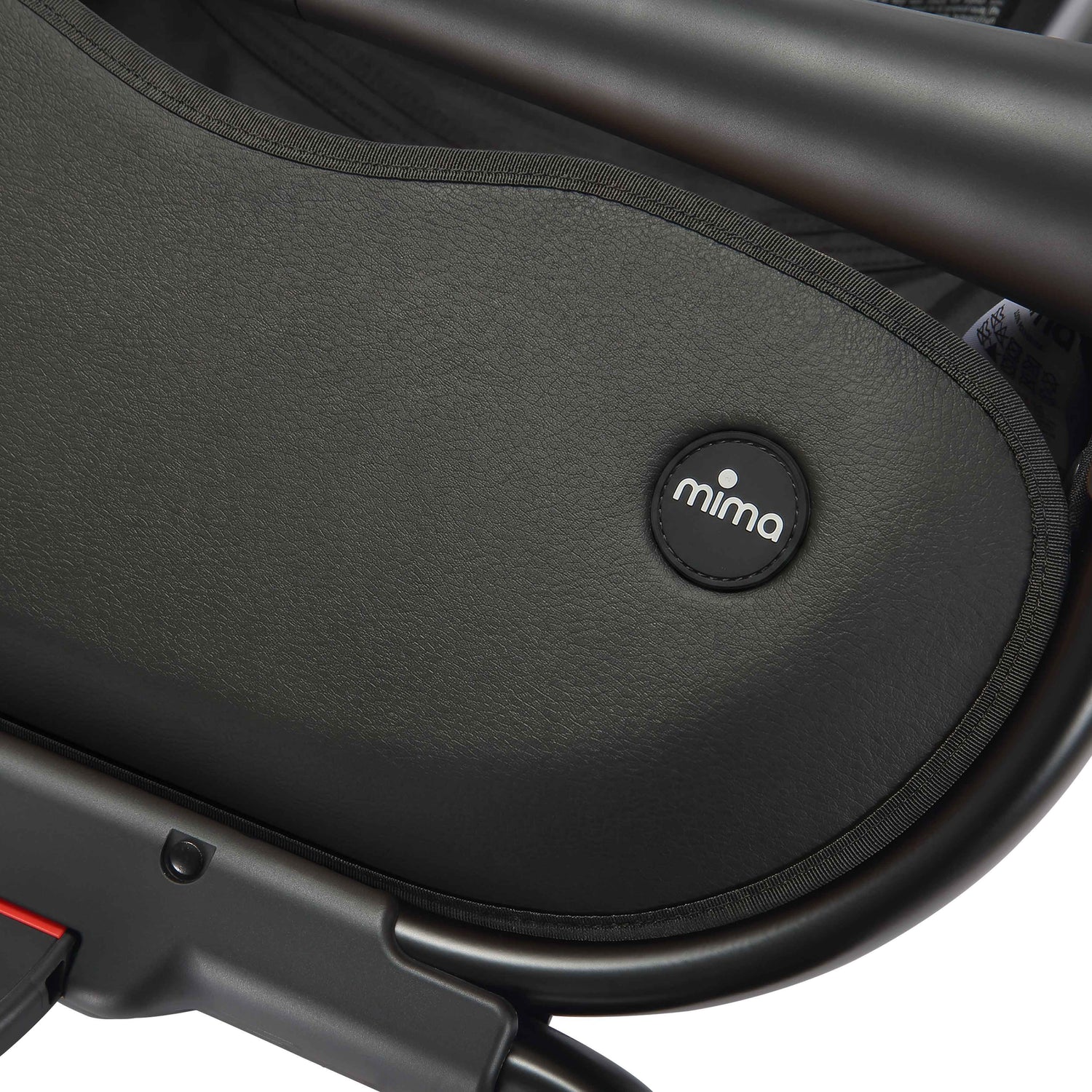 close up of the mima creo stroller basket and logo in black 
