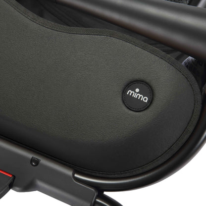 close up of the mima creo stroller basket and logo in black 