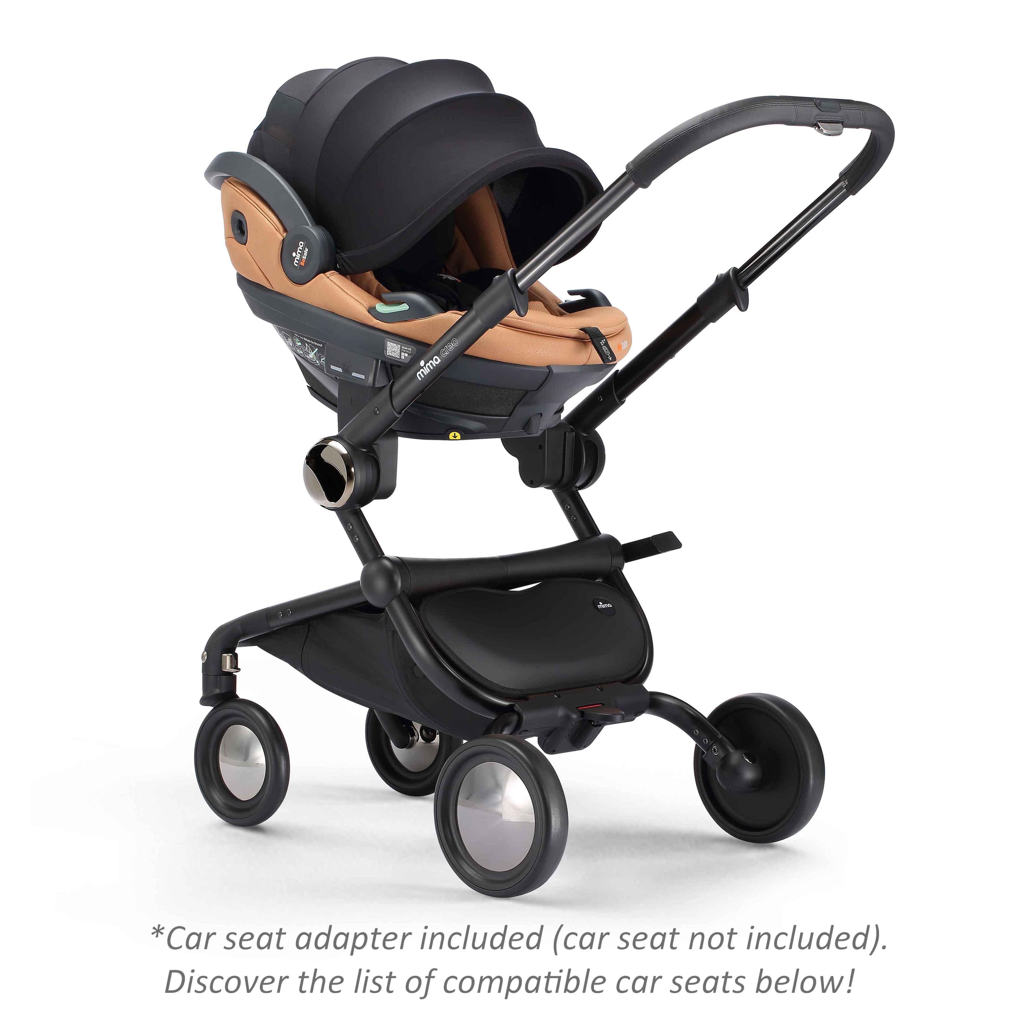 mima creo stroller in black with attached car seat, angled view 
