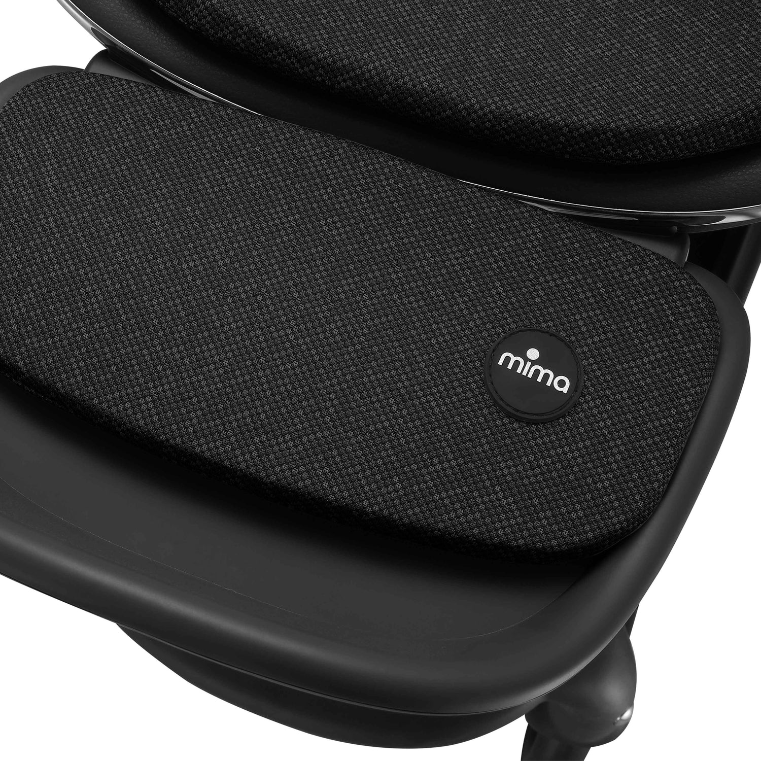 mima creo stroller footrest detail in black showing fabric texture 