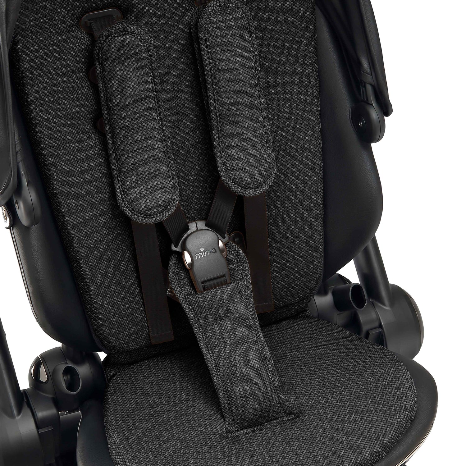 interior view of the seat pad and safety harness on mima creo in black 