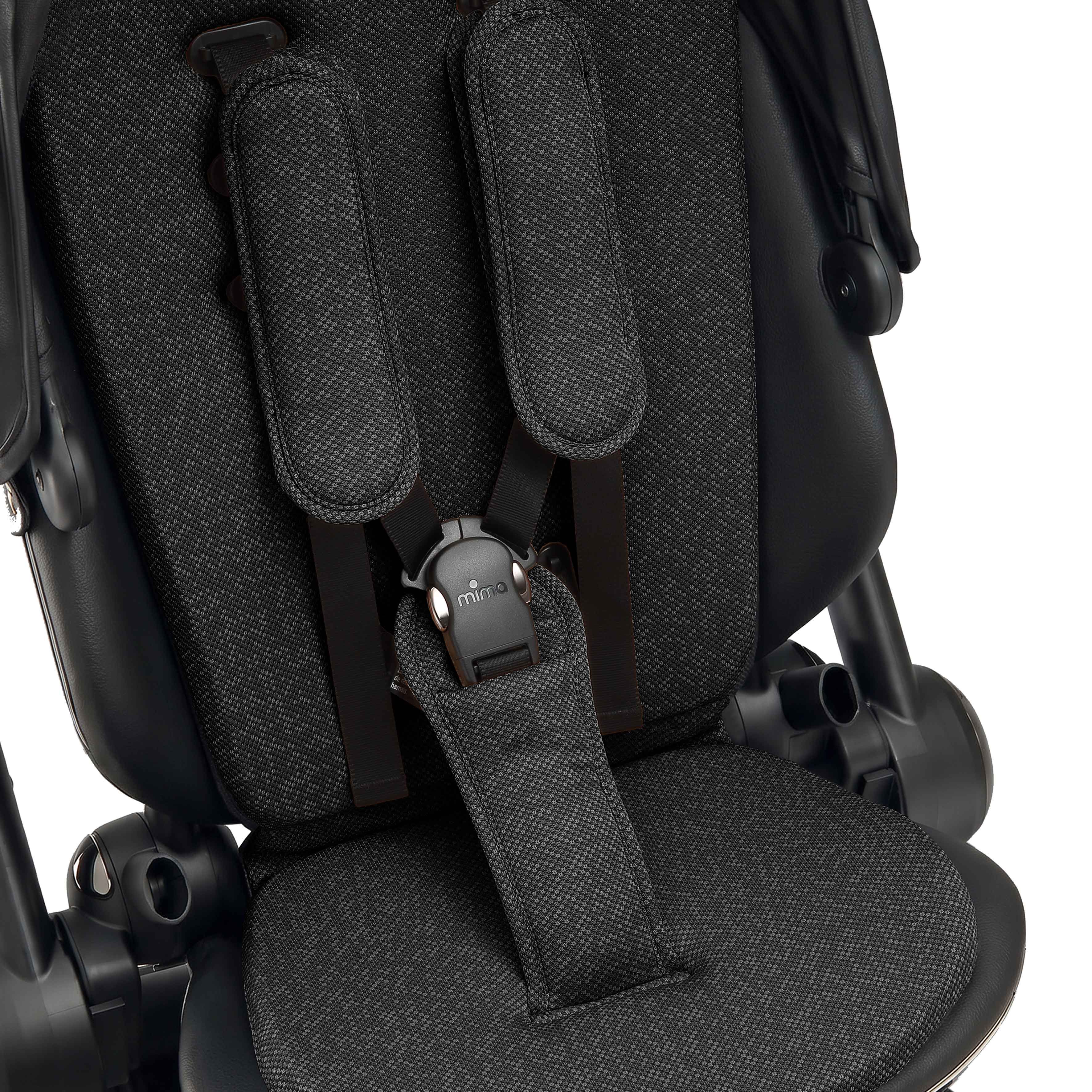 interior view of the seat pad and safety harness on mima creo in black 