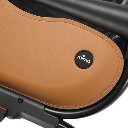 close up of the mima creo stroller basket and logo in mocha cream 