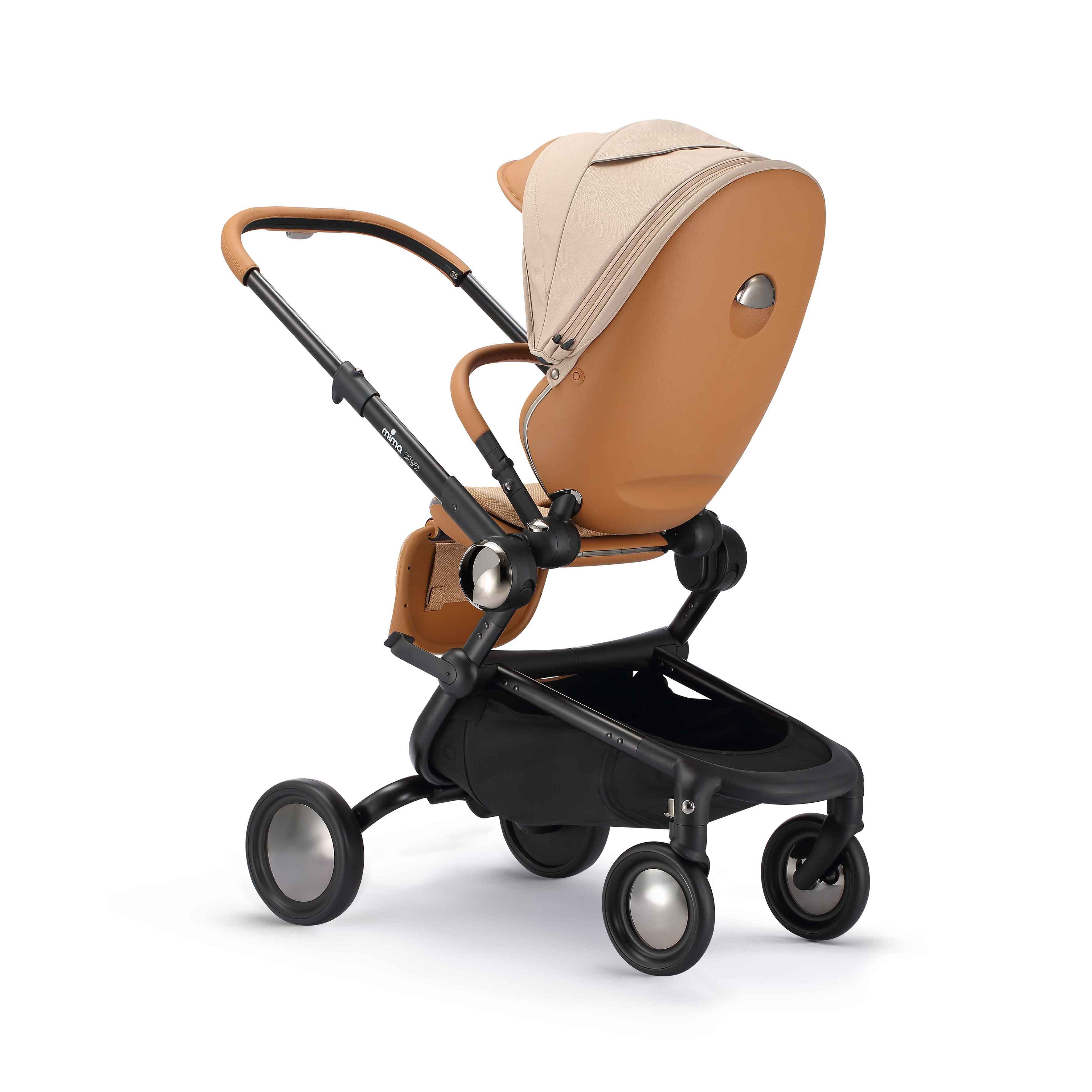 rear angled view of parent facing mima creo stroller in mocha cream 