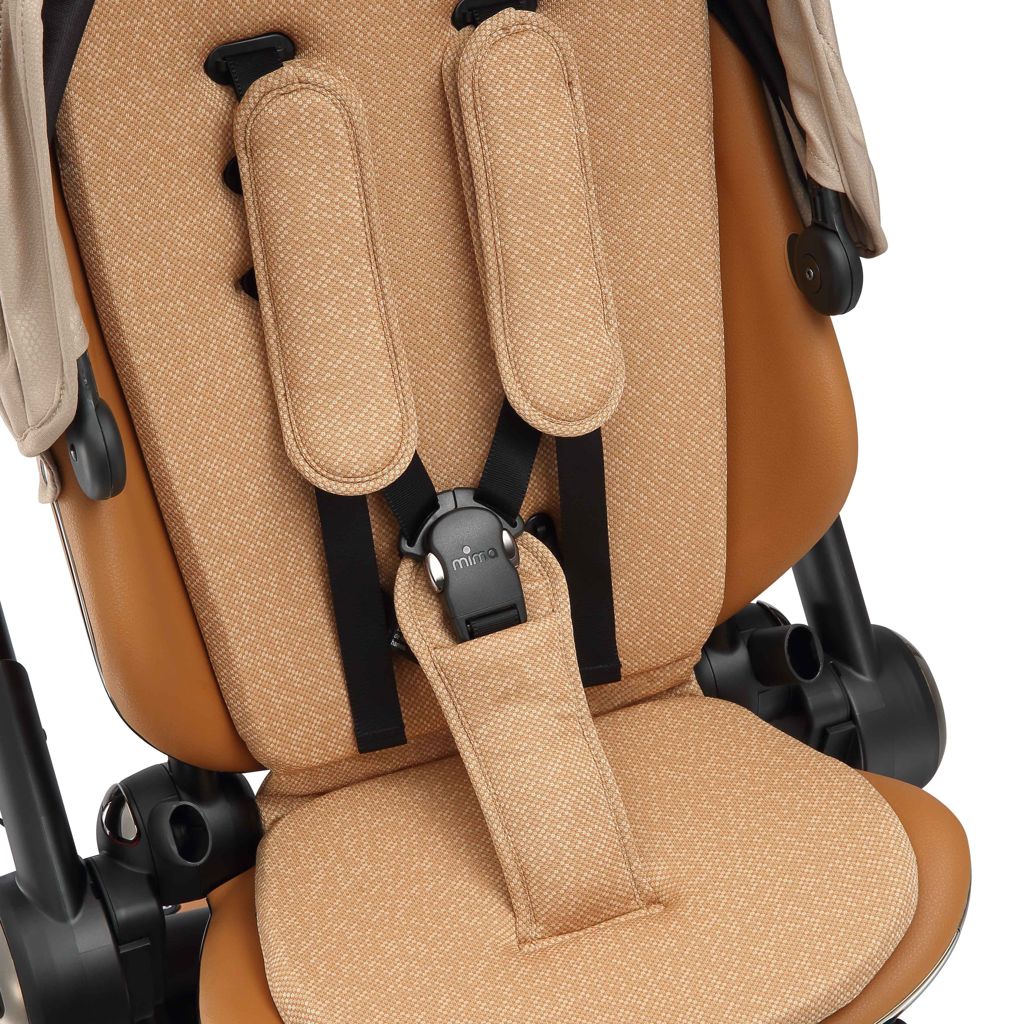 interior view of the seat pad and safety harness on mima creo in mocha cream 