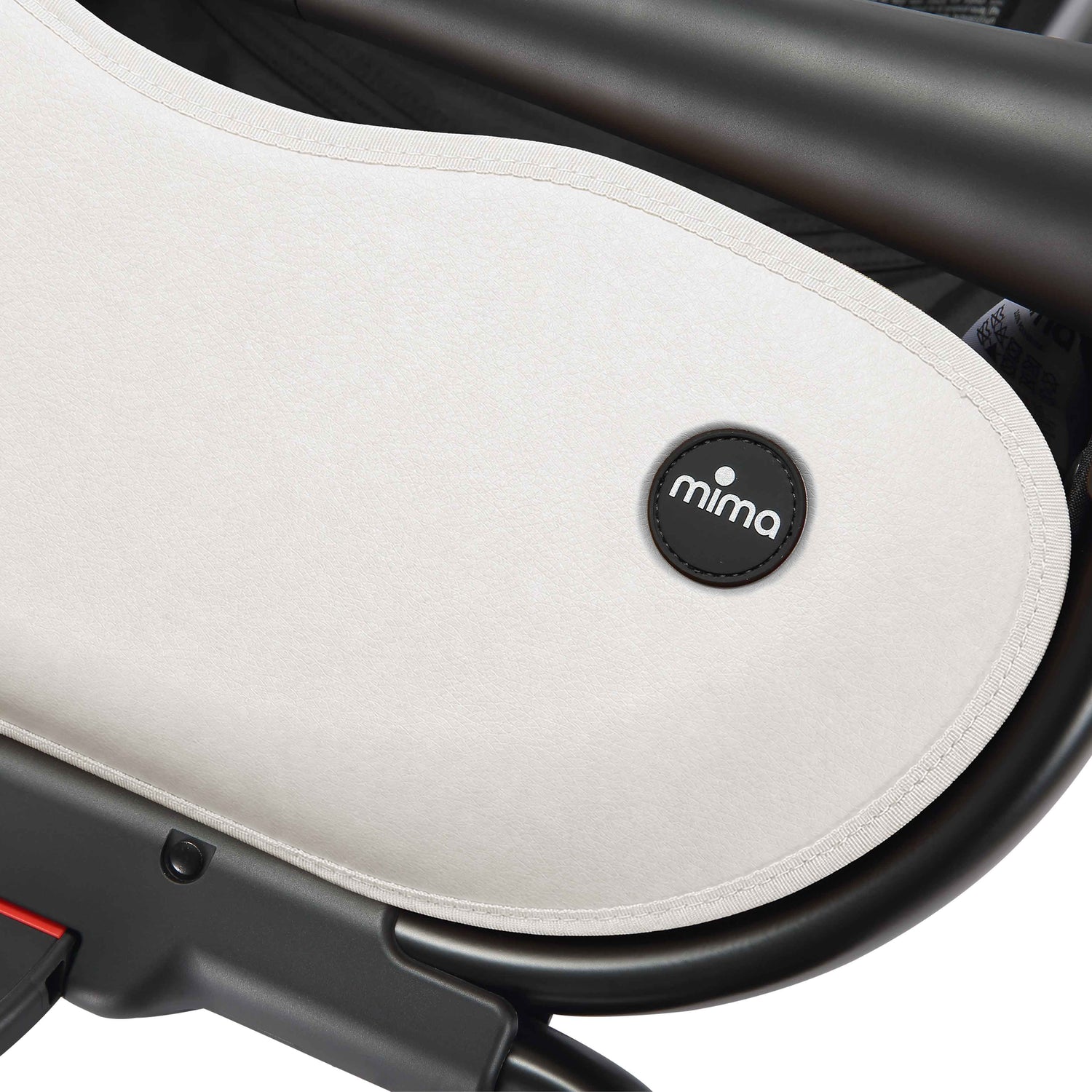 close up of the mima creo stroller basket and logo in white 