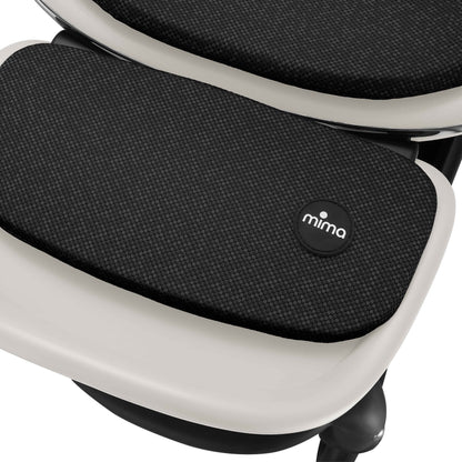 mima creo stroller footrest detail in white showing fabric texture 