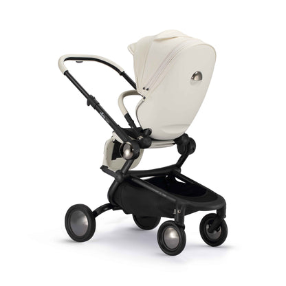 rear angled view of parent facing mima creo stroller in white 