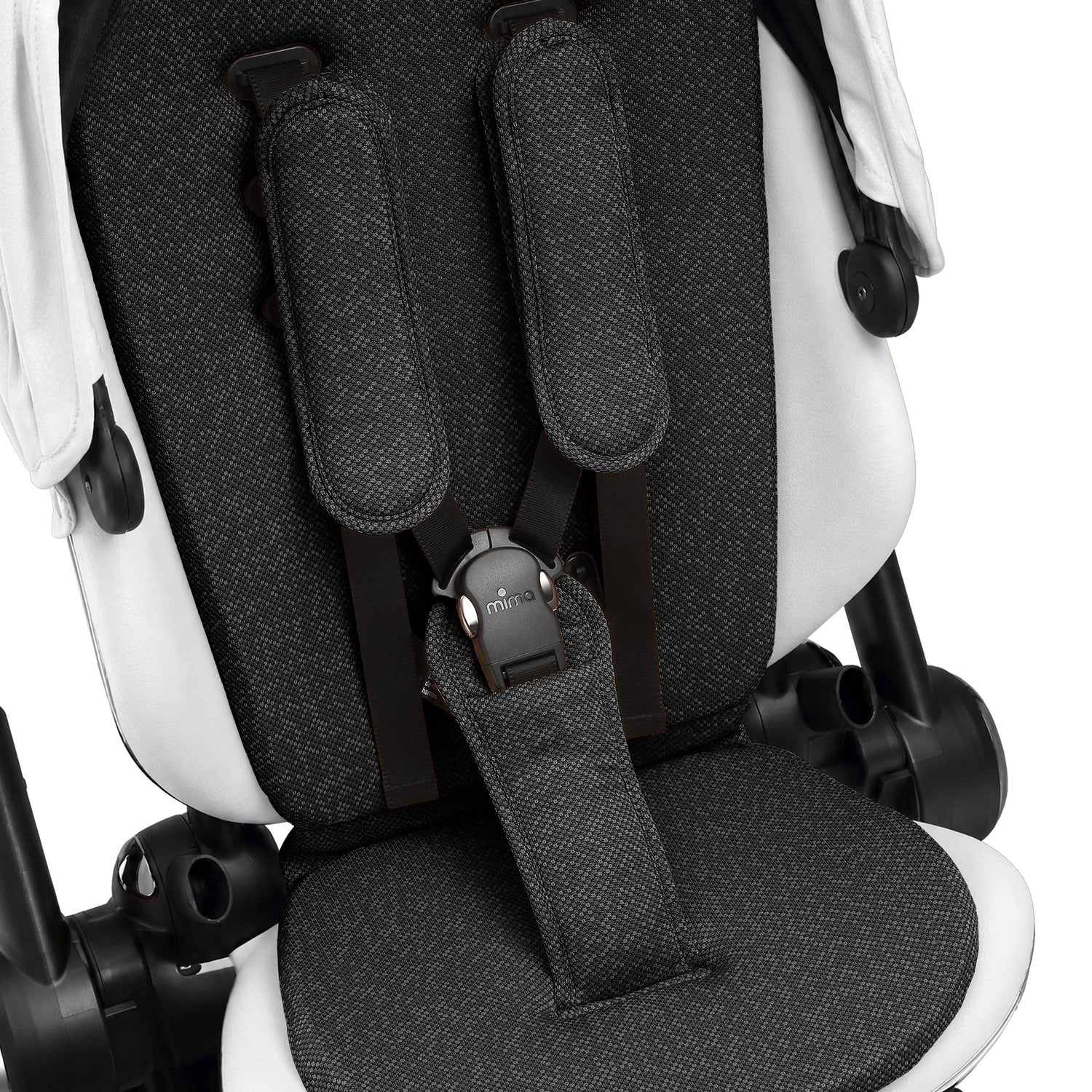 interior view of the seat pad and safety harness on mima creo in white 