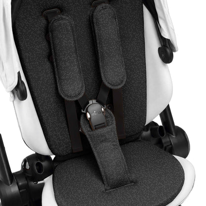 interior view of the seat pad and safety harness on mima creo in white 