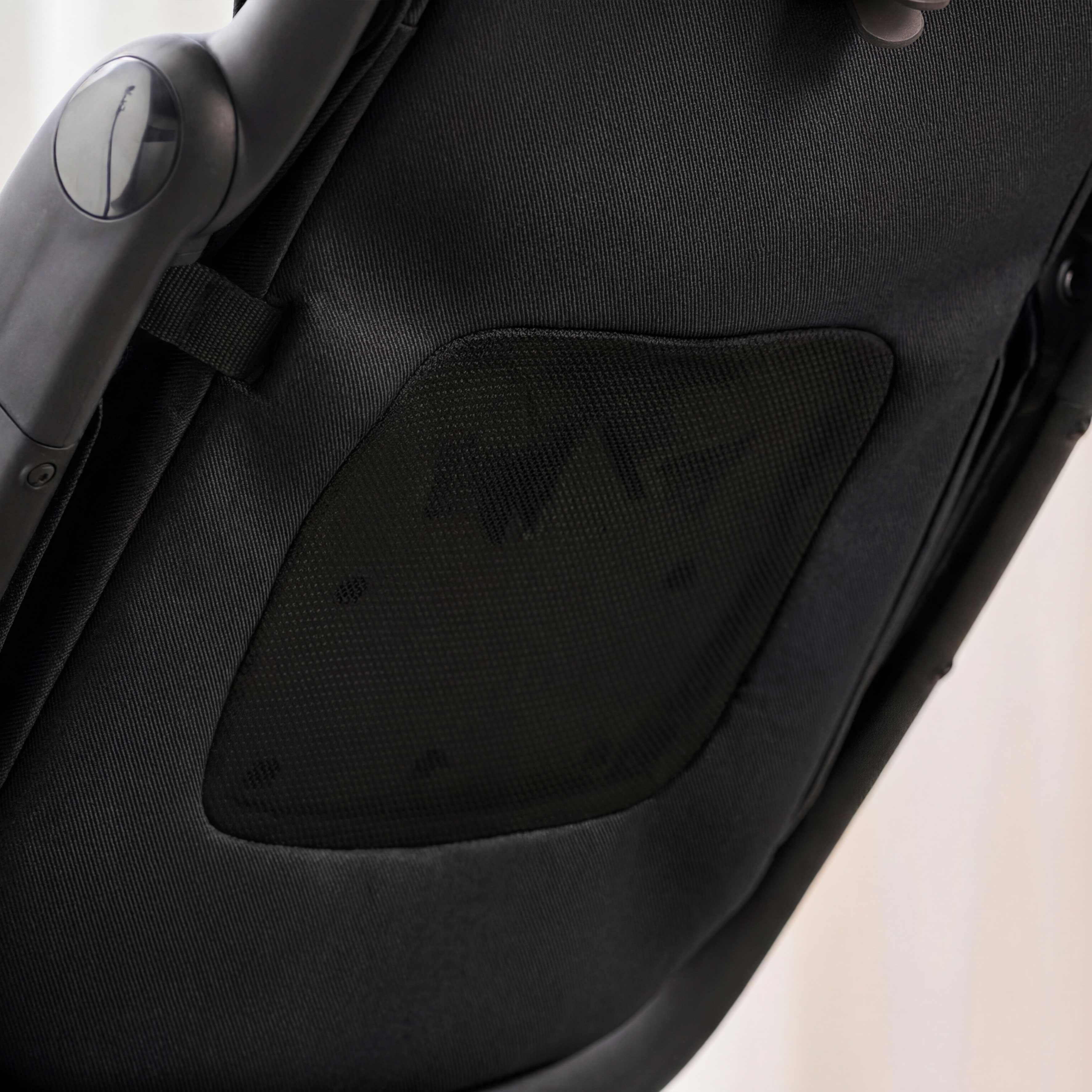 close up of backrest mesh ventilation on miro compact stroller in black 