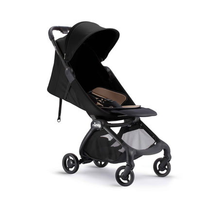 mima miro stroller in black with light reclined seat and shadow, angled view 