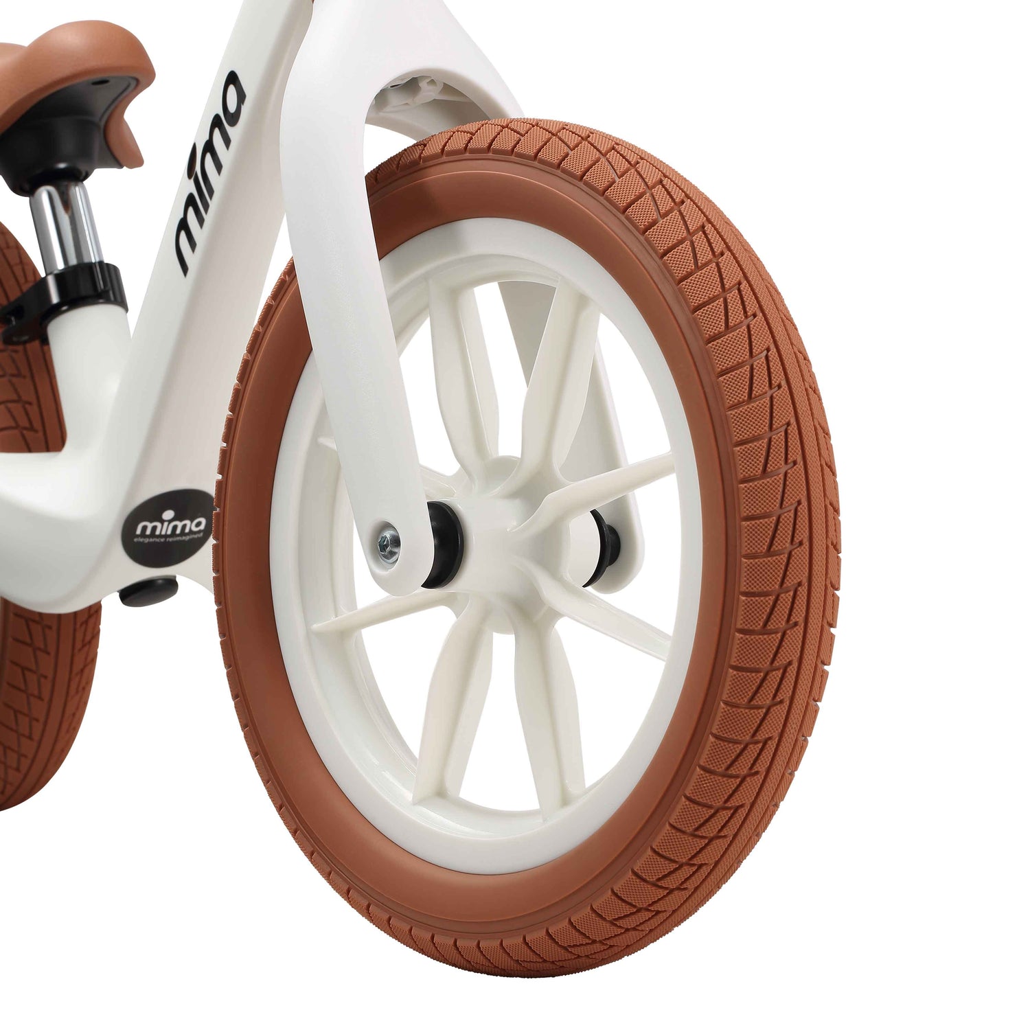 close up of the front wheel on mima zoom lite balance bike in white 