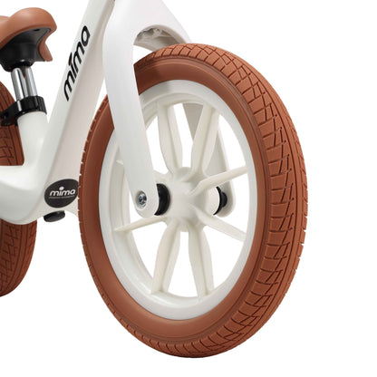 close up of the front wheel on mima zoom lite balance bike in white 