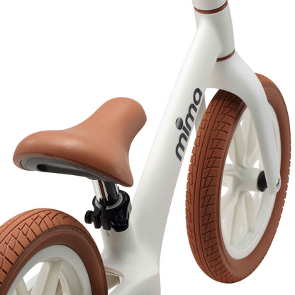 close up of the seat saddle on mima zoom lite balance bike in white 