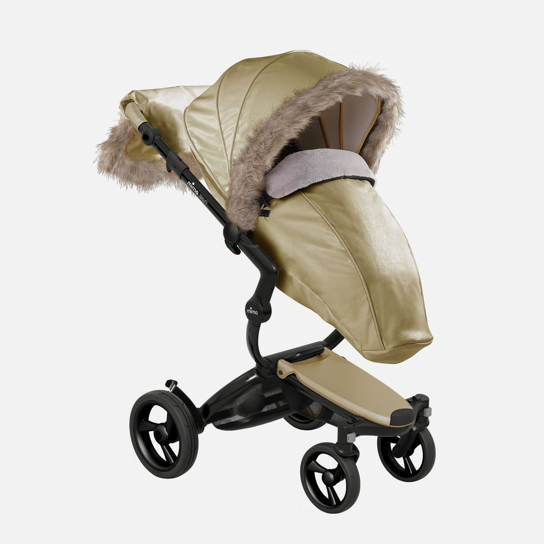 Cold weather stroller footmuff and canopy cover Xari Signature gold Champagne Mima Xari stroller with winter outfit, left front view, includes wind protector, footmuff and hand muff 